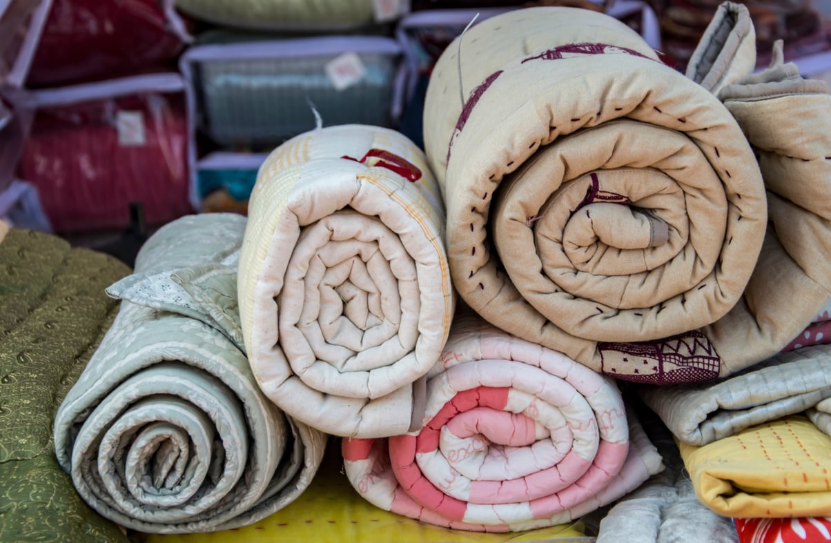 Pile of rolled quilts